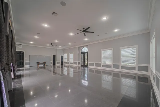 a view of a room with lots of wooden furniture