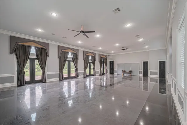 a view of a lobby with furniture and floor to ceiling window