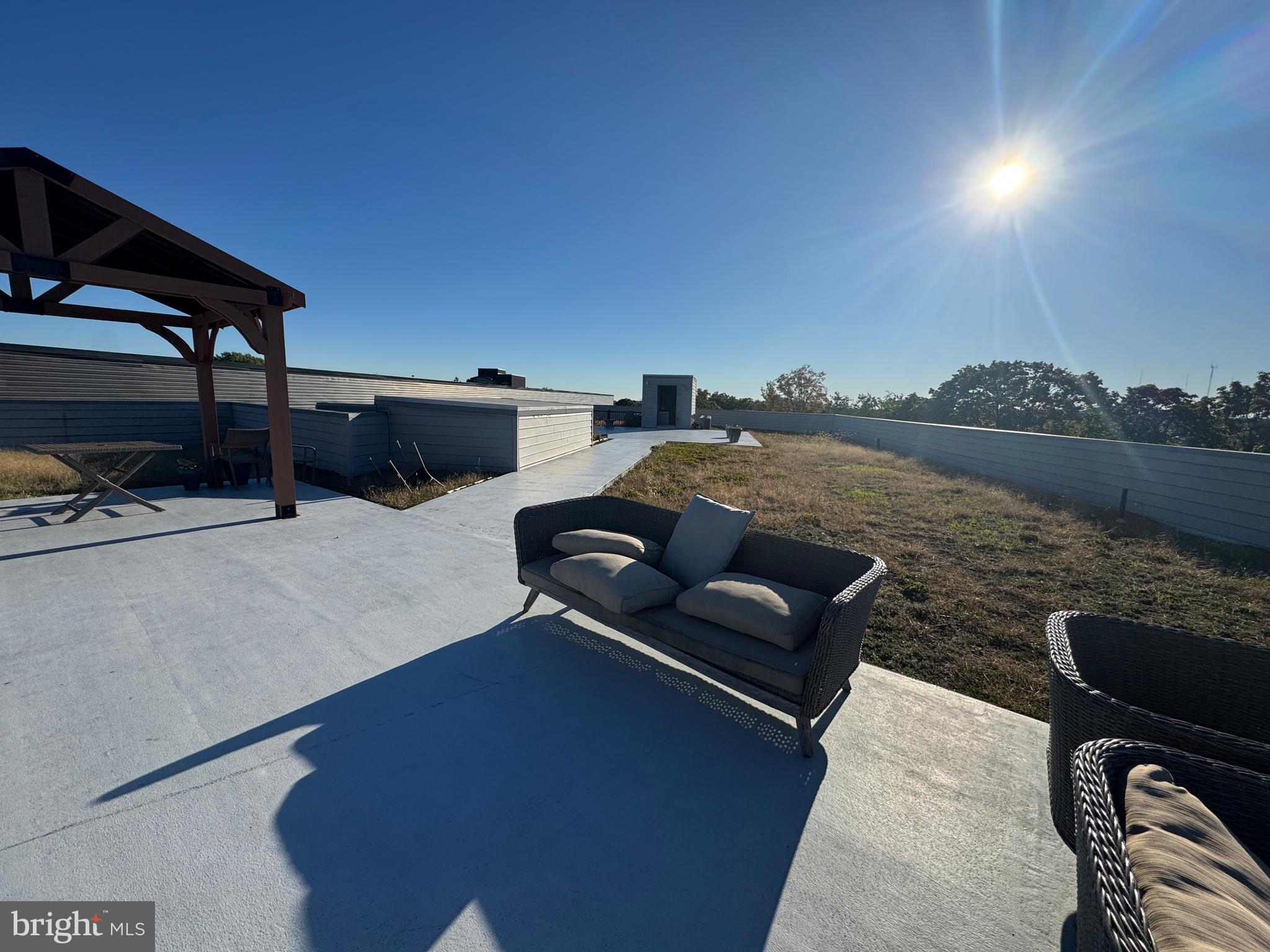 6610 Germantown Avenue, Unit LL6 Philadelphia, PA 19119 - Photo 13 of 38 a terrace with outdoor seating and city view