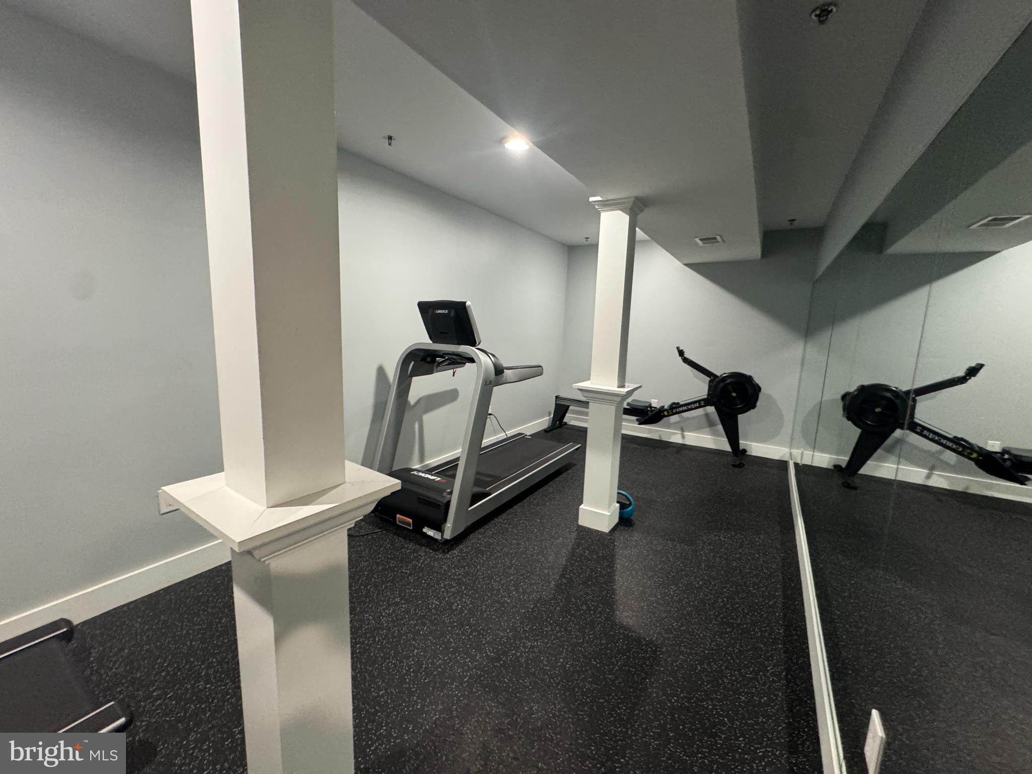 6610 Germantown Avenue, Unit LL6 Philadelphia, PA 19119 - Photo 17 of 38 a room with gym equipment and a table