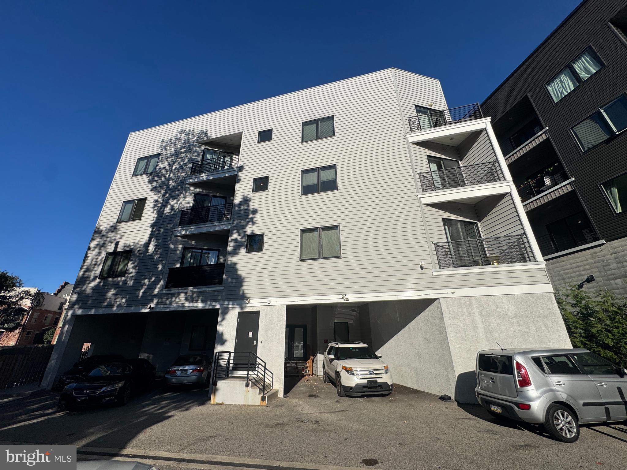 6610 Germantown Avenue, Unit LL6 Philadelphia, PA 19119 - Photo 20 of 38 a car parked in front of a building