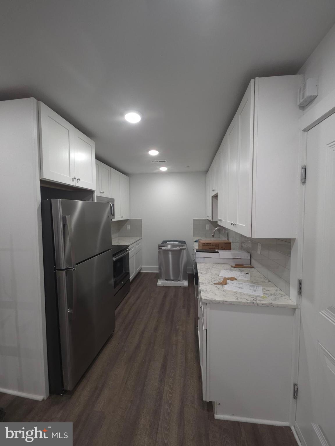 6610 Germantown Avenue, Unit LL6 Philadelphia, PA 19119 - Photo 26 of 38 a kitchen with a refrigerator sink and stove
