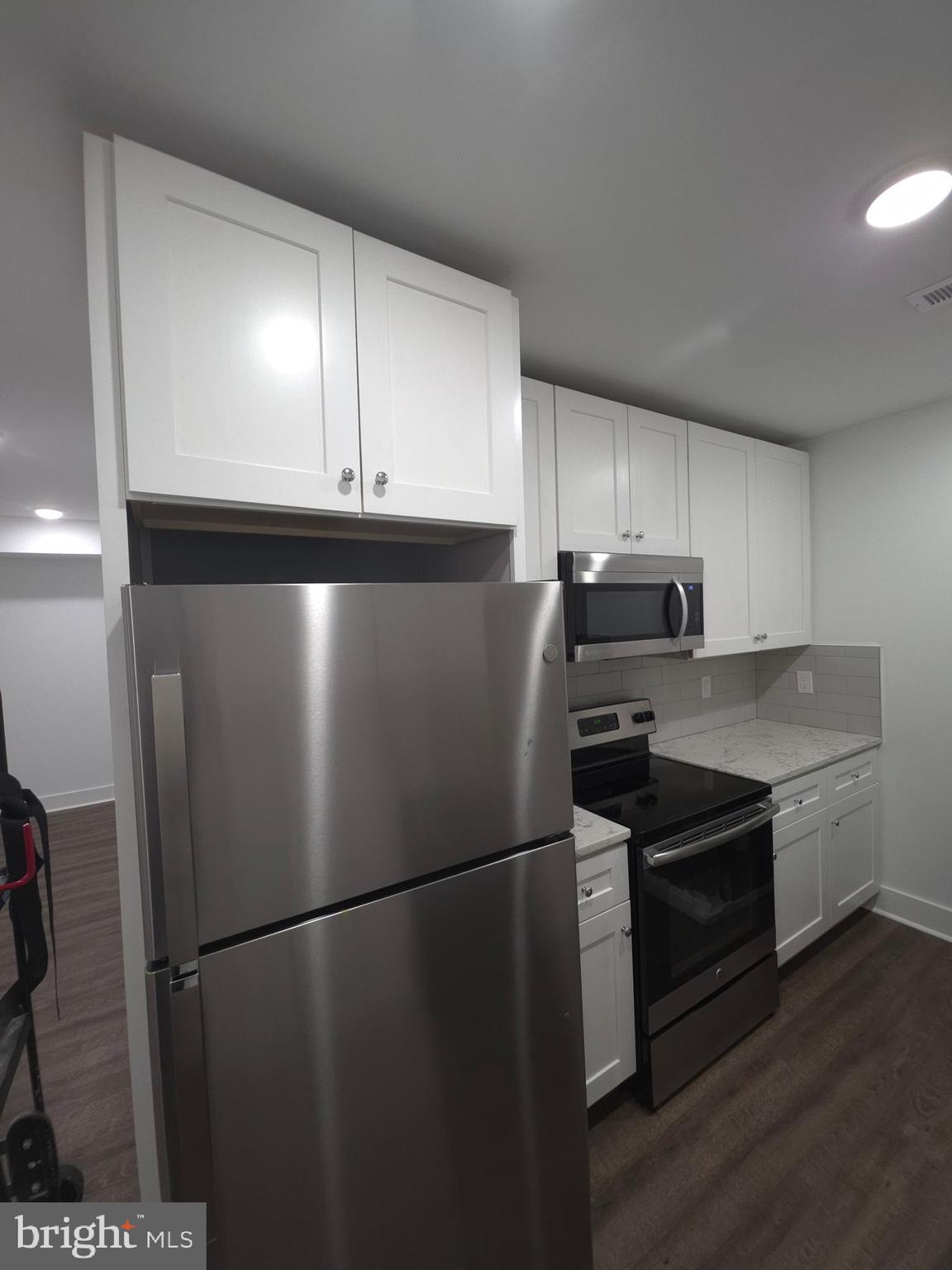 6610 Germantown Avenue, Unit LL6 Philadelphia, PA 19119 - Photo 27 of 38 a view of a refrigerator in kitchen and a sink