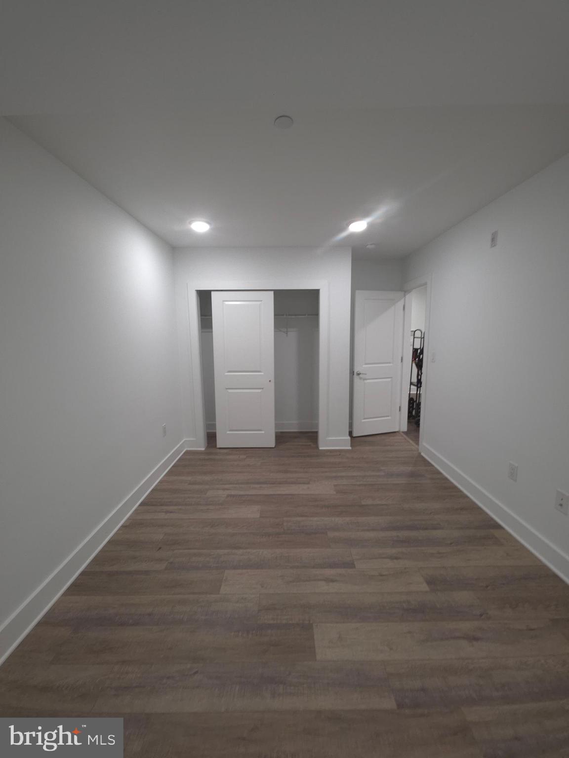 6610 Germantown Avenue, Unit LL6 Philadelphia, PA 19119 - Photo 29 of 38 a view of an empty room with wooden floor