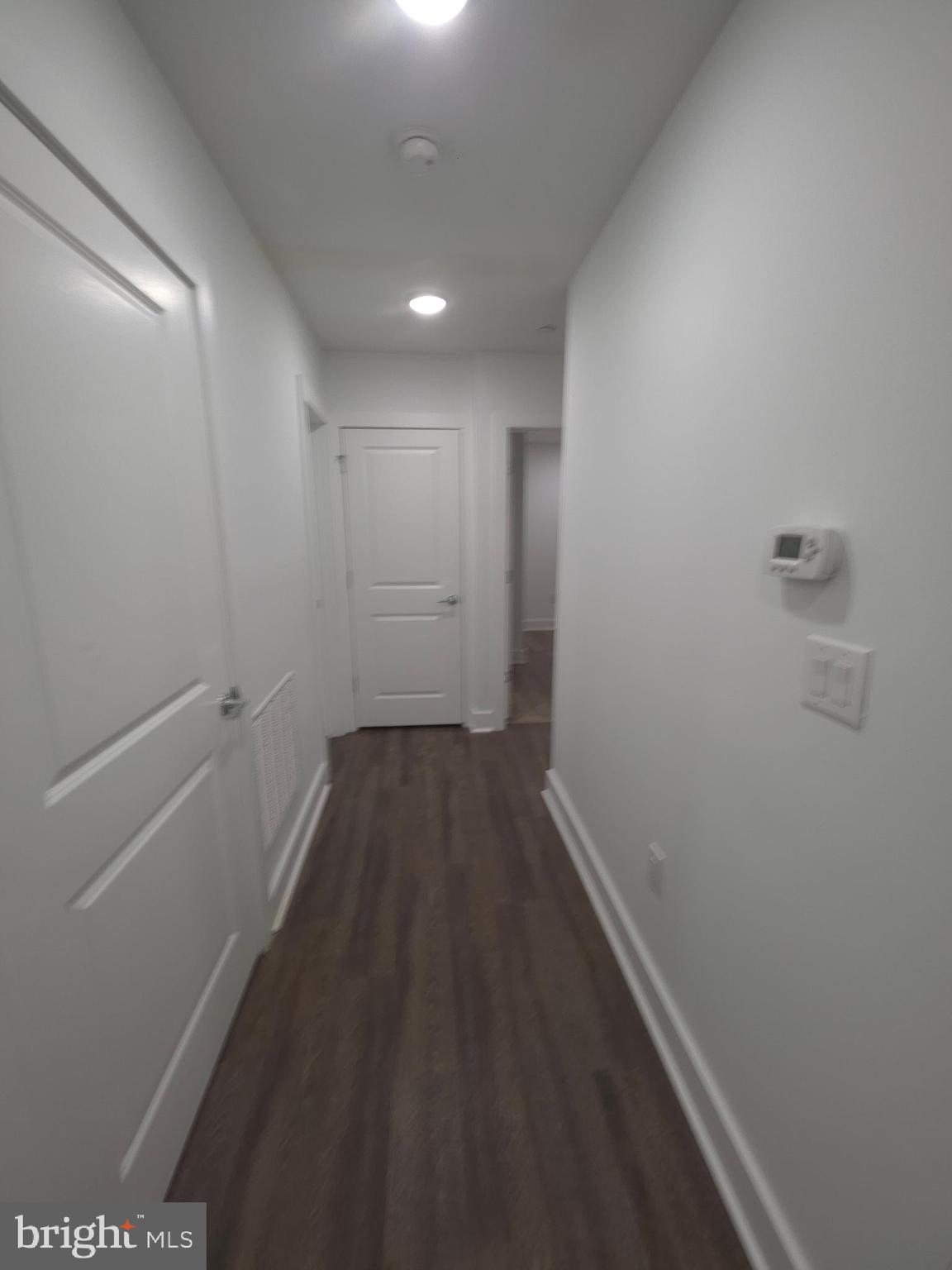 6610 Germantown Avenue, Unit LL6 Philadelphia, PA 19119 - Photo 31 of 38 a view of a hallway with wooden floor