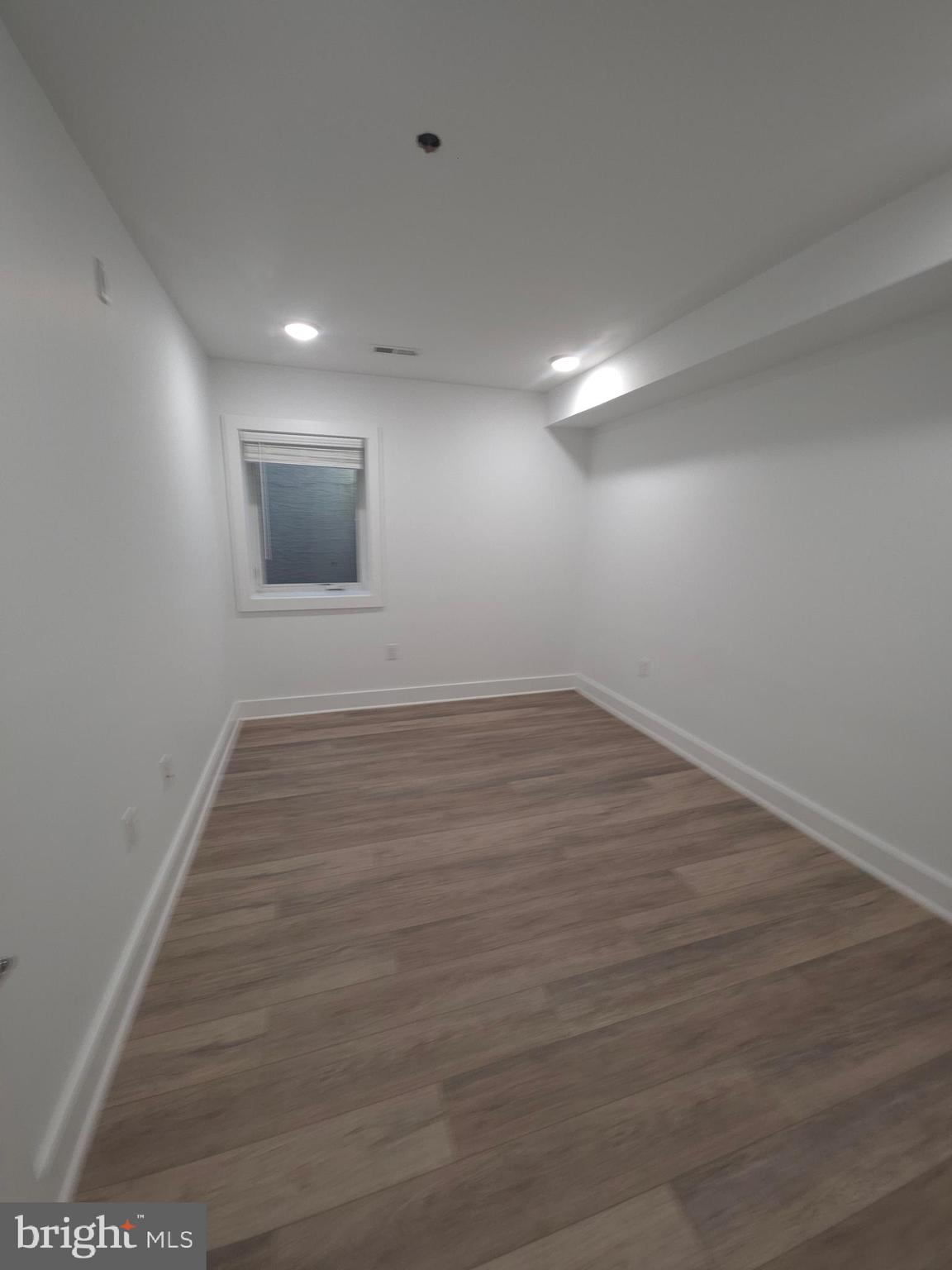 6610 Germantown Avenue, Unit LL6 Philadelphia, PA 19119 - Photo 34 of 38 wooden floor in an empty room