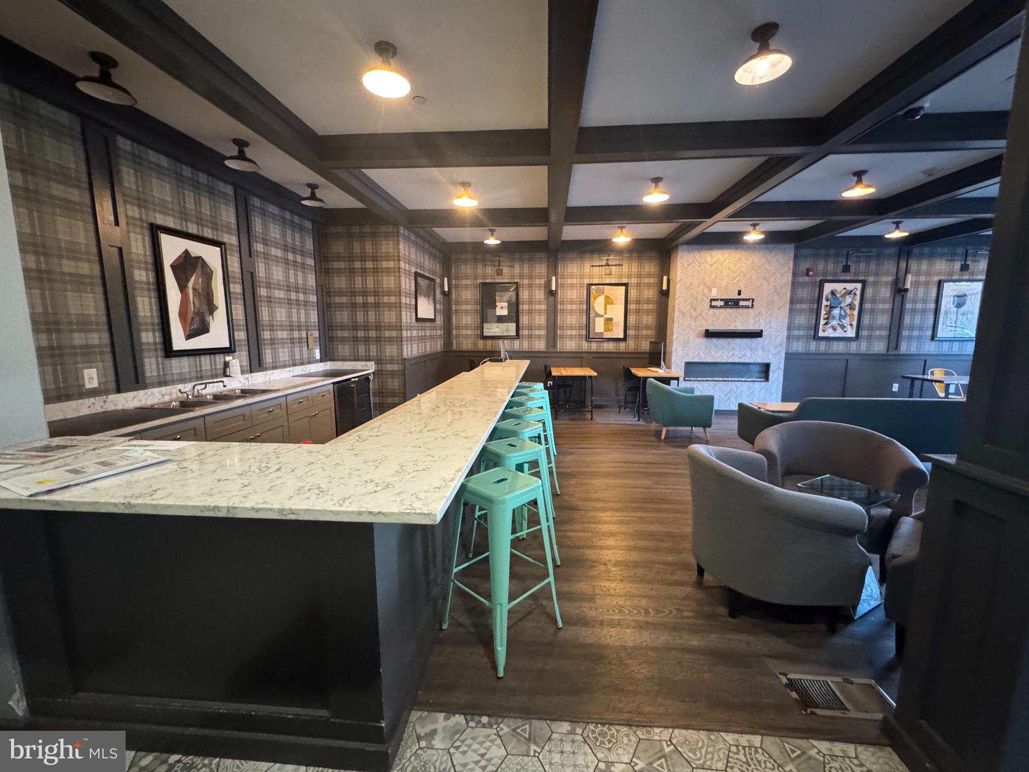 6610 Germantown Avenue, Unit LL6 Philadelphia, PA 19119 - Photo 7 of 38 a living room with furniture a flat screen tv and a table
