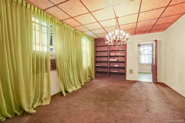 a view of a room with window and furniture