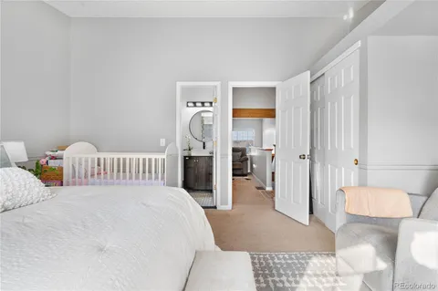 a bedroom with a bed and a view of bathroom