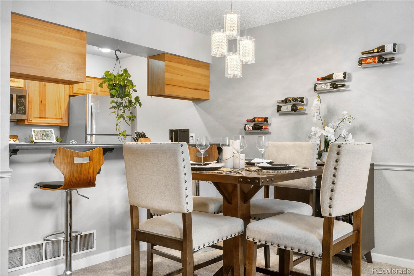 5155 West 68th Avenue, Unit 5 Westminster, CO 80030 - Photo 7 of 33 a view of a dining room with furniture and chandelier