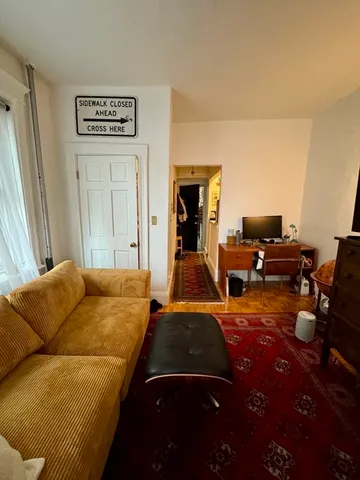 a bedroom with furniture and a bed