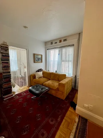 a bedroom with bed and a flat screen tv