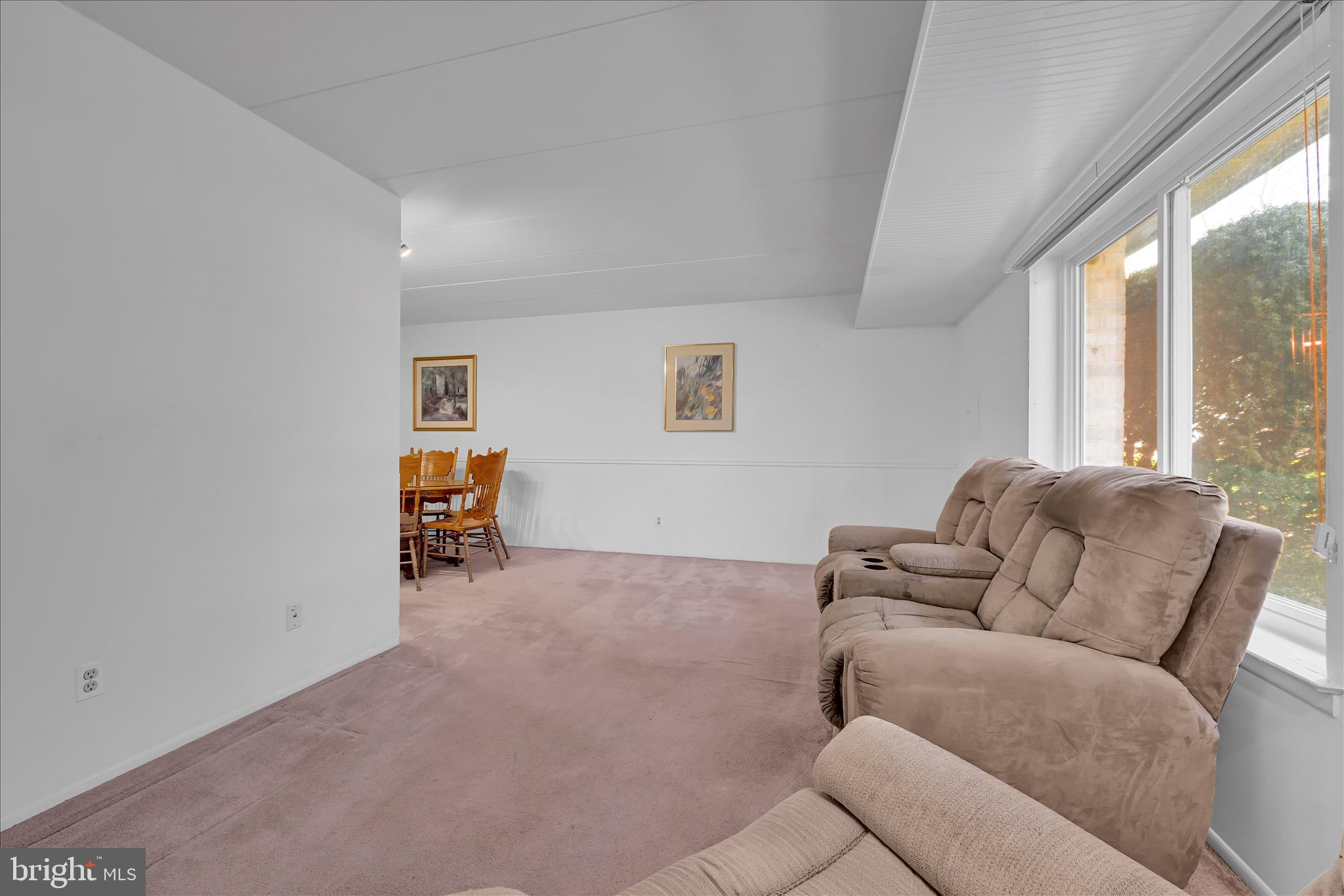 402 Village Walk, Unit 402 Exton, PA 19341 - Photo 3 of 27 a living room with furniture and a window