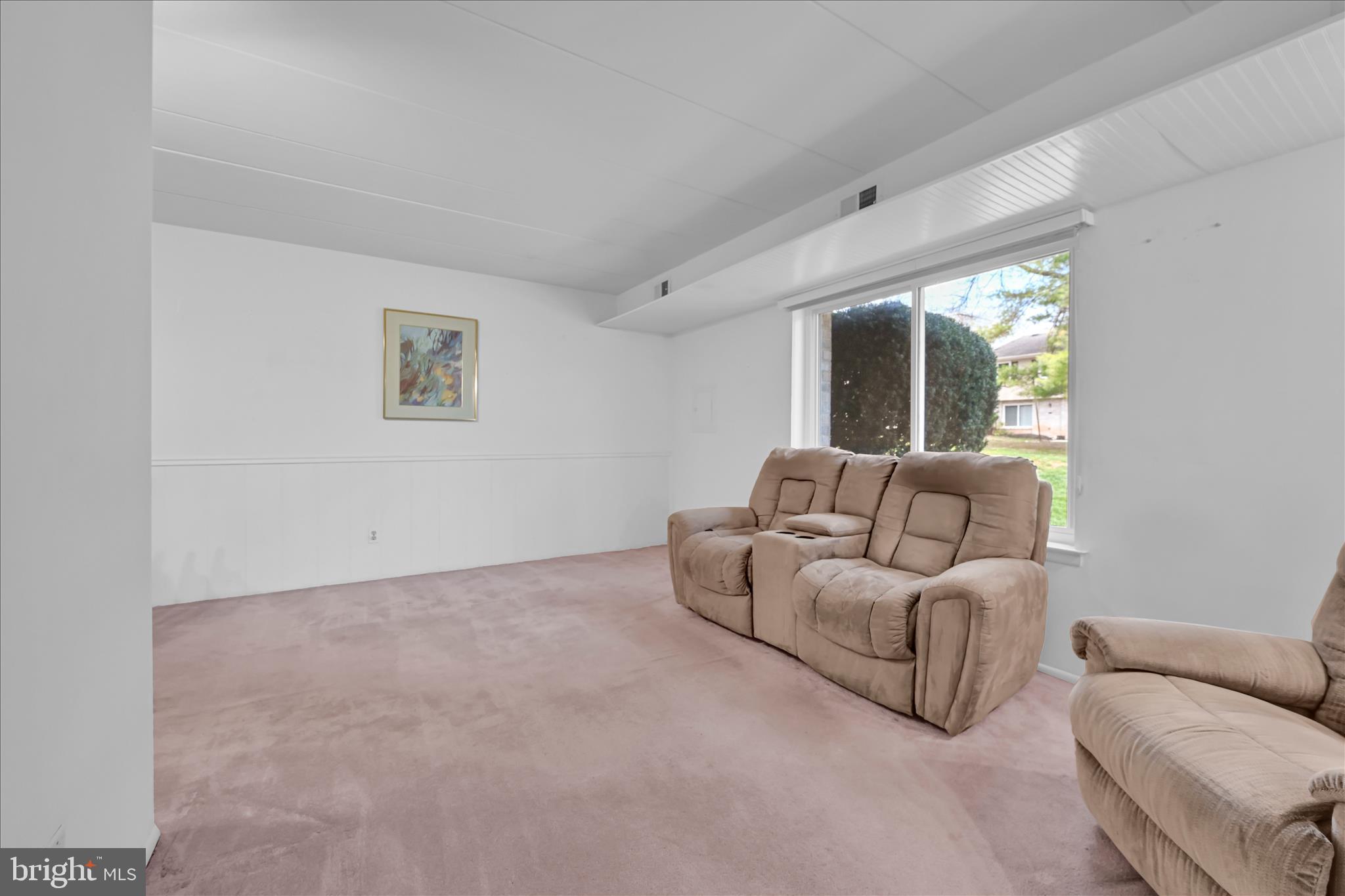 402 Village Walk, Unit 402 Exton, PA 19341 - Photo 4 of 27 a living room with furniture and a large window