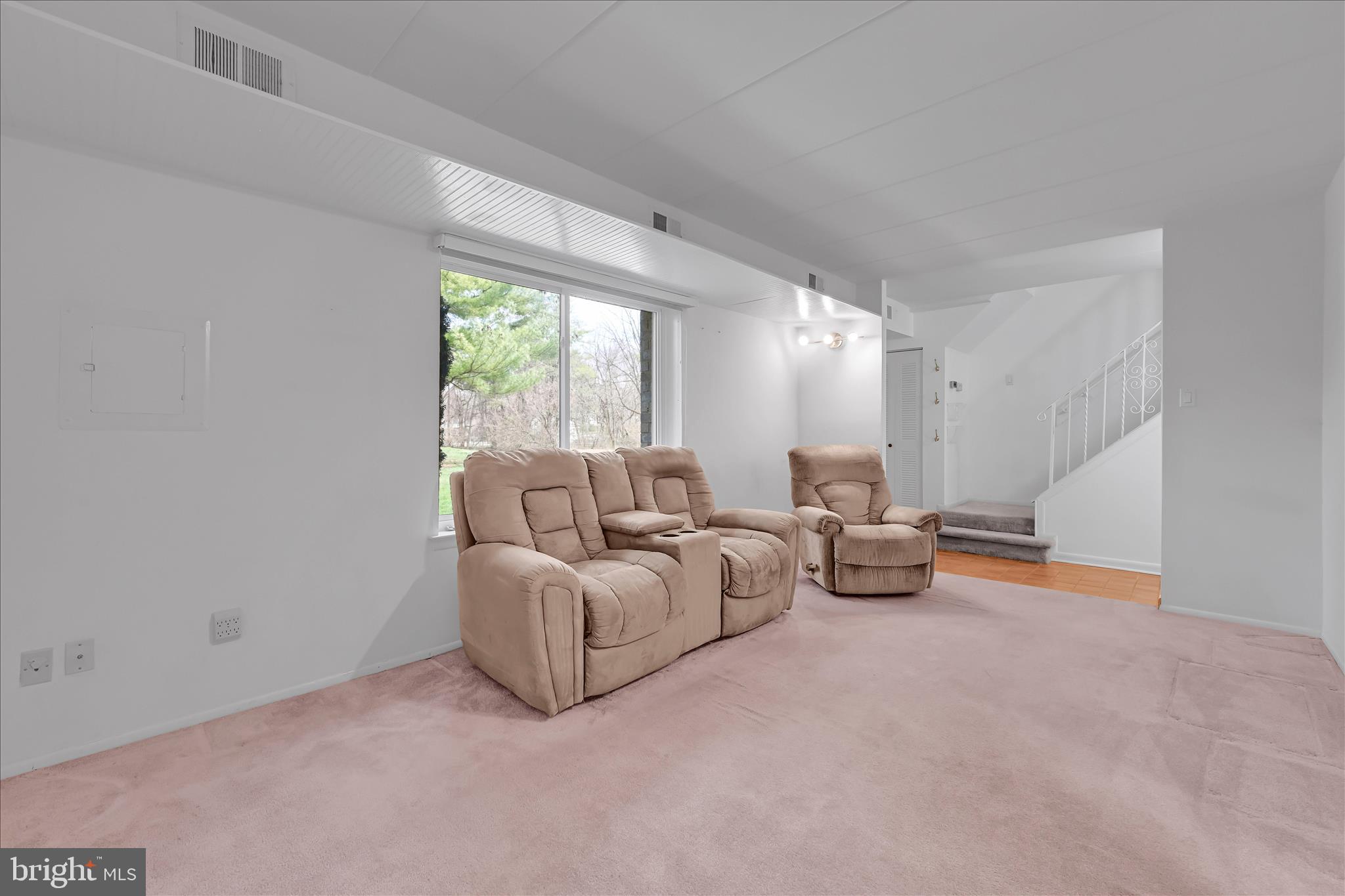 402 Village Walk, Unit 402 Exton, PA 19341 - Photo 5 of 27 a living room with furniture and a large window