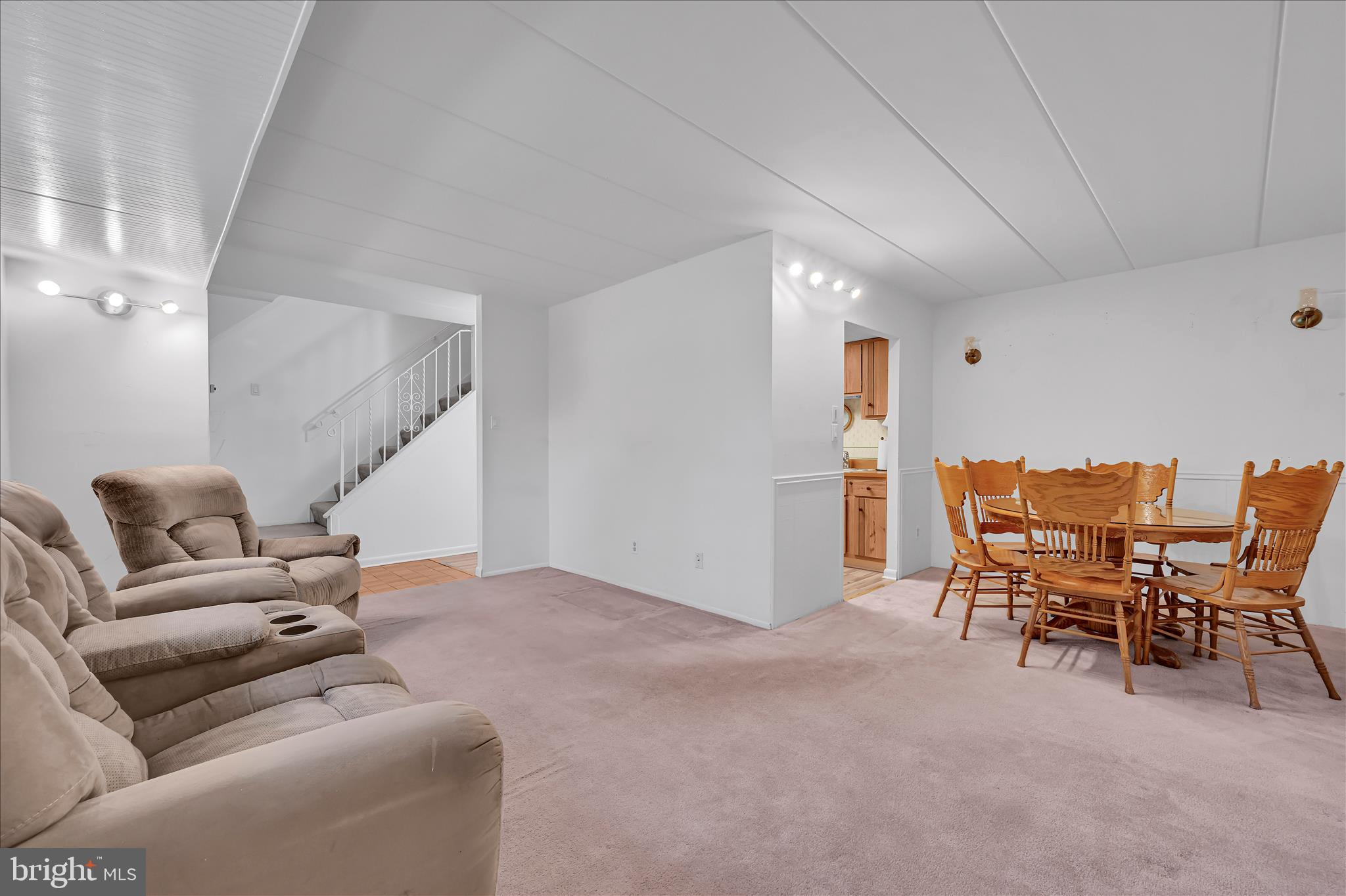 402 Village Walk, Unit 402 Exton, PA 19341 - Photo 6 of 27 a living room with furniture and a view of kitchen