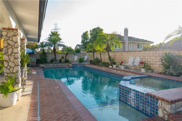 a view of a swimming pool with a patio
