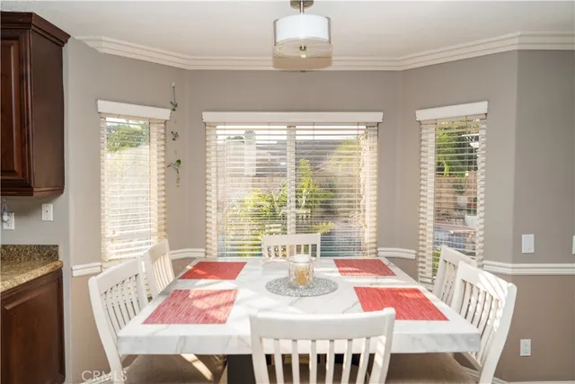 a bedroom with a bed and a table