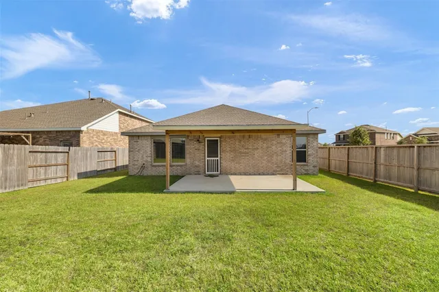 a view of a yard in front of a house with a yard