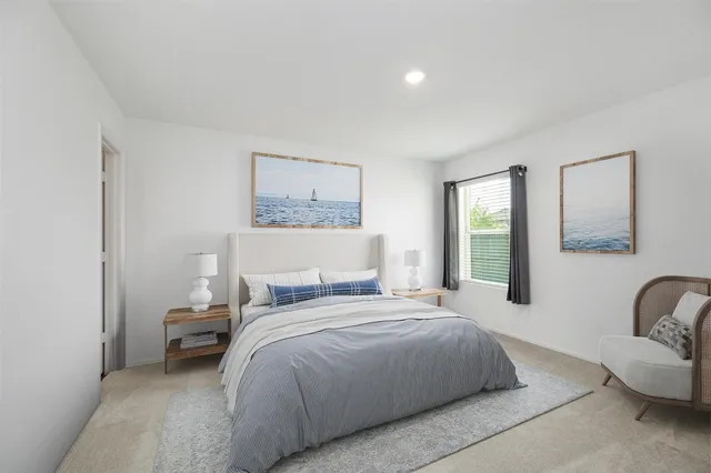 a bedroom with a bed and a couch