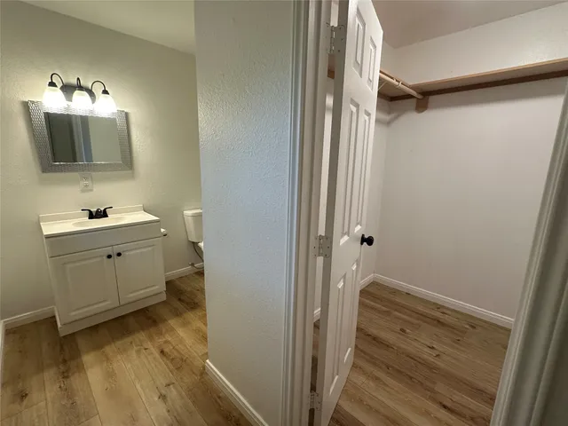 a room with a bed and a mirror