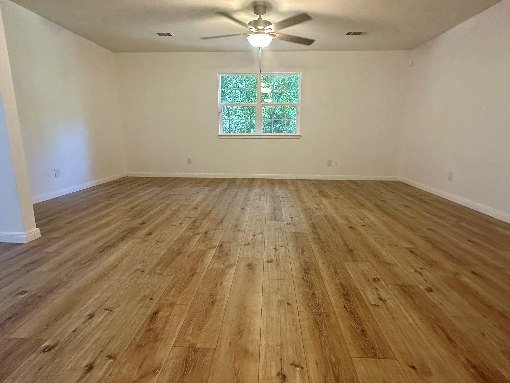 146 Barbara Lane Shepherd, TX 77371 - Photo 4 of 20 wooden floor in an empty room