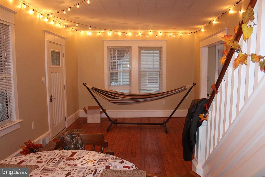 320 University Boulevard Glassboro, NJ 08028 - Photo 15 of 25 a bedroom with a bed and wooden floor