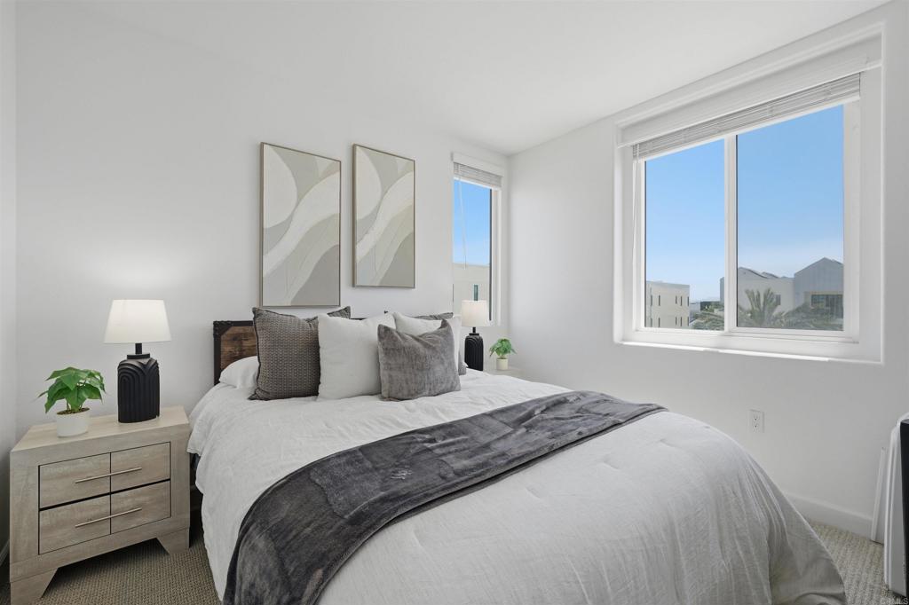 2402 Cascalote Loop San Diego, CA 92154 - Photo 24 of 35 a bedroom with a bed and window