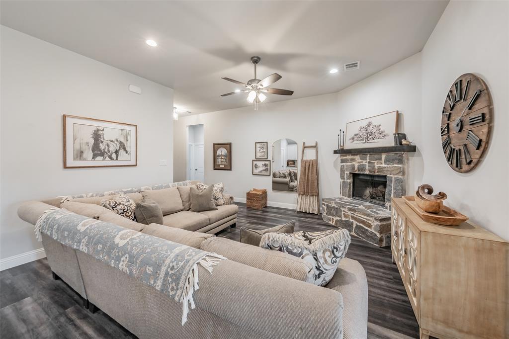141 Maverick Lane Pilot Point, TX 76258 - Photo 18 of 40 a living room with furniture and a fireplace