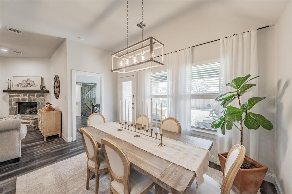 141 Maverick Lane Pilot Point, TX 76258 - Photo 25 of 40 a view of a dining room with furniture window and wooden floor