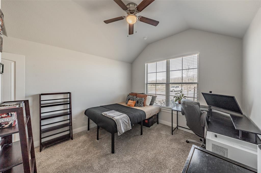 141 Maverick Lane Pilot Point, TX 76258 - Photo 27 of 40 a room with a bed and a window