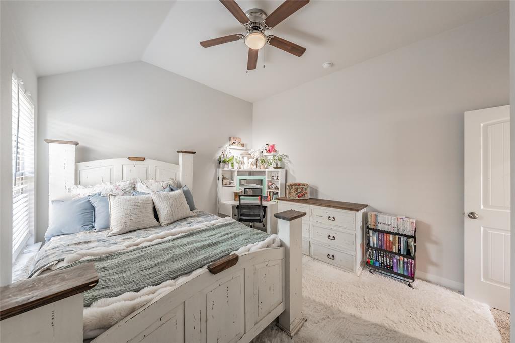 141 Maverick Lane Pilot Point, TX 76258 - Photo 30 of 40 a living room with furniture and a chandelier