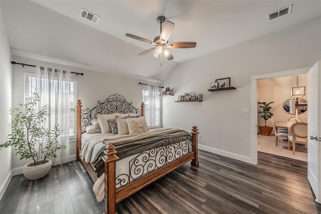 141 Maverick Lane Pilot Point, TX 76258 - Photo 31 of 40 a bedroom with a bed and wooden floor