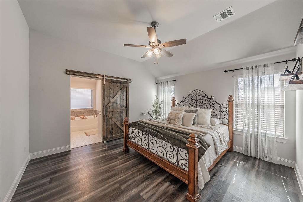 141 Maverick Lane Pilot Point, TX 76258 - Photo 33 of 40 a bedroom with a bed and a window