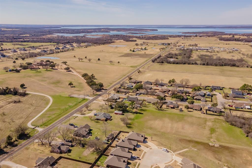 141 Maverick Lane Pilot Point, TX 76258 - Photo 6 of 40 an aerial view of ocean and residential houses with outdoor space