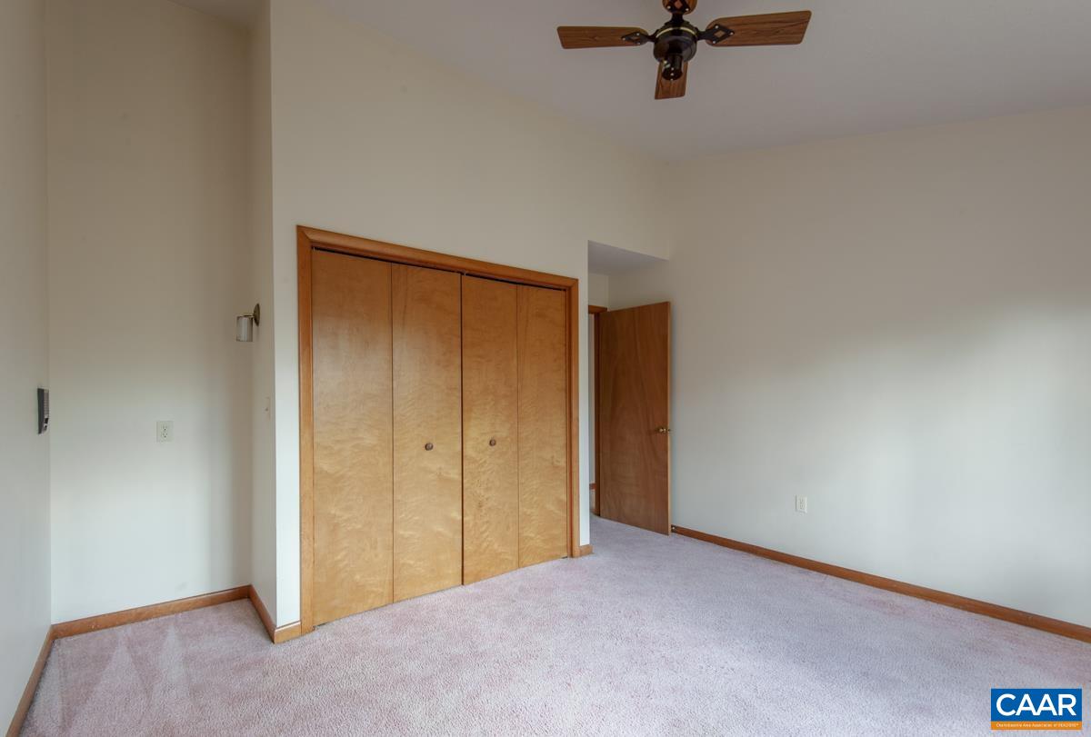 3849 Buck Island Road Charlottesville, VA 22902 - Photo 24 of 50 a view of a livingroom with a ceiling fan