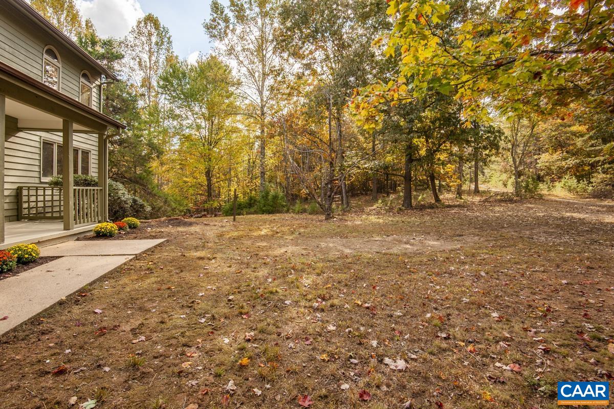 3849 Buck Island Road Charlottesville, VA 22902 - Photo 49 of 50 a view of dirt field with trees in the background
