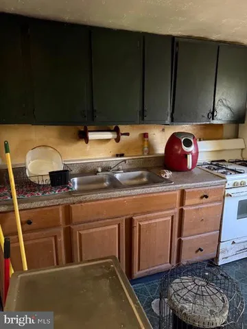 a kitchen with a stove and cabinets