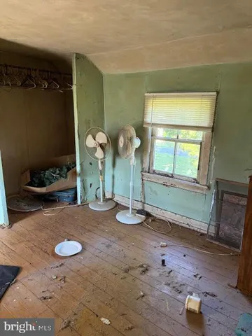 a view of a livingroom with wooden floor