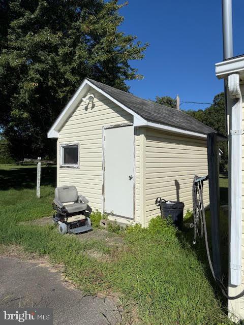 53 Fulton Street Cheswold, DE 19904 - Photo 17 of 17 a view of a white house with a yard and plants
