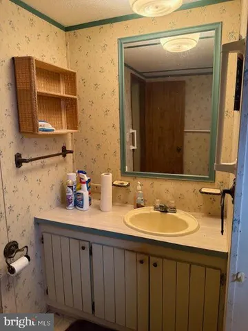 a bathroom with a sink double vanity and a mirror
