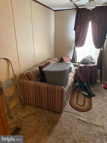 a bedroom with bed and a window