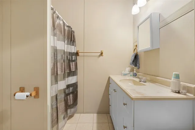 a bedroom with a bed and a rug