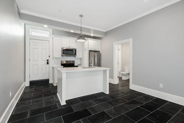 a kitchen with a sink and cabinets