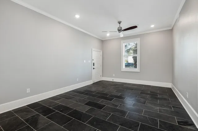 a view of a kitchen with a sink and dishwasher a refrigerator with white cabinets
