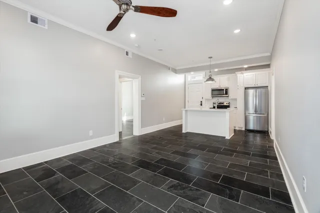 a kitchen with a sink a stove and cabinets