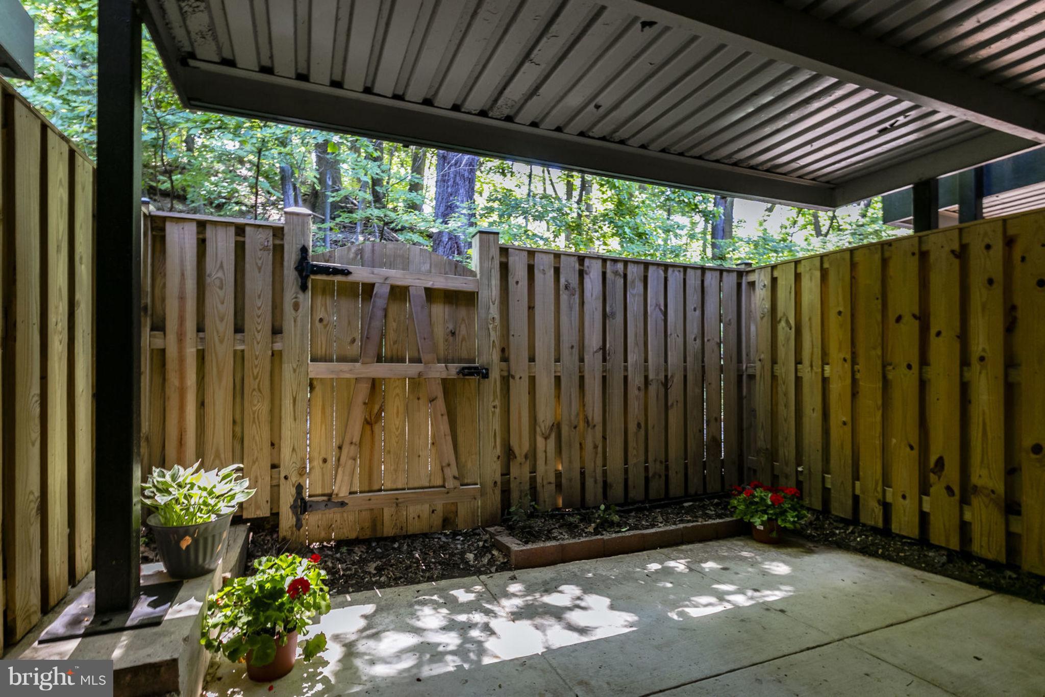 4653 28th Road South, Unit A Arlington, VA 22206 - Photo 23 of 25 PRIVATE PATIO BACKING TO TREES