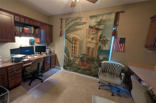 a view of a workspace with furniture and a livingroom