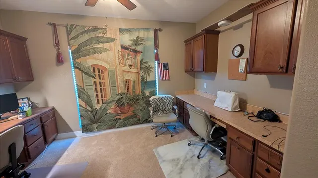 a bedroom with a workspace