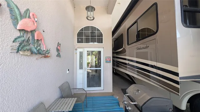 a view of an entryway with wooden floor